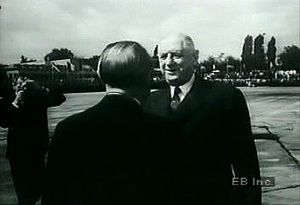 Watch West German Chancellor Adenauer greet French President de Gaulle to forge diplomatic ties after WWII