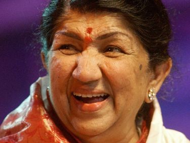 Indian singer Lata Mangeshkar smiles during her 75th Birthday celebrations at the Andheri Sports Complex in Bombay, India, September 28, 2003.