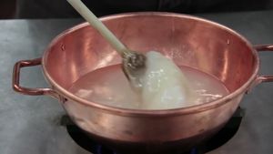 See a professor using science to demonstrate the stages of making lemon drop candy