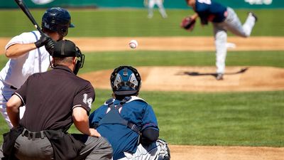 Pitcher releases pitch, heading towards batter (baseball, sports, catcher, umpire).