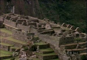 Zoom in on the ancient Inca ruins of Machu Picchu, in the Cordillera de Vilcabamba of the Peruvian Andes